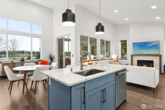 Center island overlooks the dining area with lake views.