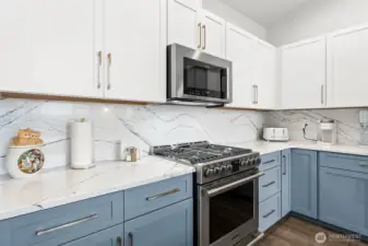Beautifully updated kitchen featuring a gas range and contemporary finishes.