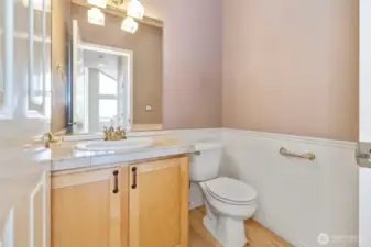 1/2 bath on main level at the end of the hall.