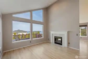 2-sided fireplace divides the 2 living spaces.