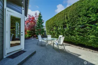 Step outside to an expansive and private patio with multiple seating areas for relaxing or entertaining.