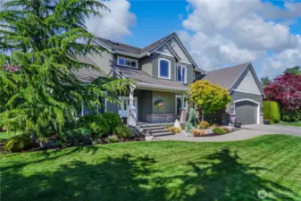 This home is perfectly situated on a corner lot and showcases incredible curb appeal—pride of ownership is evident at every turn.