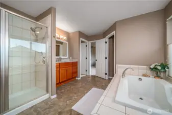 The primary bath also includes a walk-in shower for added convenience.