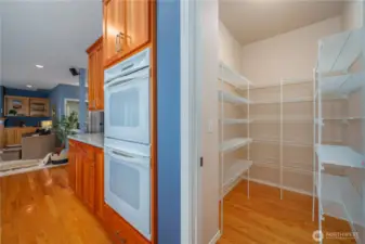 Don’t miss the spacious walk-in pantry complete with custom shelf organizers.