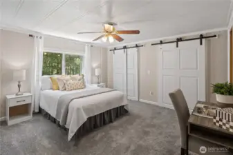 Primary Bedroom with barn door closet doors!