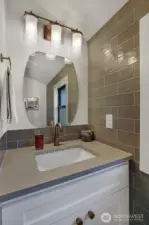 Powder room located upstairs.