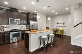 The generous kitchen has extra tall upper cabinets offering loads of space for your dishes etc...