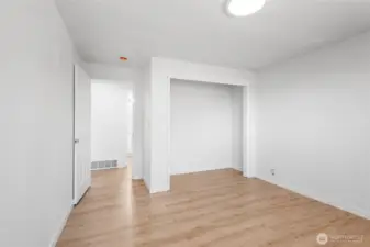 Main level bedroom, full of natural light, ready for you to add your finishing touches.