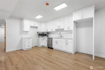 Kitchenette boasts new counters, cabinets and space for a refridgerator and stove.