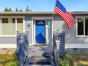 A blue door welcomes you into the home.