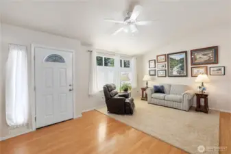 Enter into the large formal living room with upgraded top-down blinds
