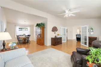 Living room connects to the dining room and the family room with french doors