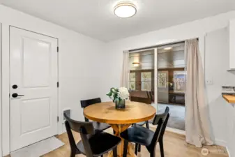 Dining Room leading into enclosed extra bonus game room/craft room/or outdoor living space.