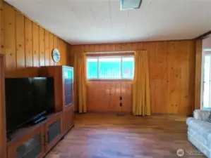 Livingroom has access from porch/kitchen and the entry