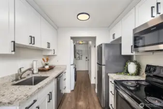 Updated chef's kitchen with stainless steel appliances.