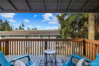 Private covered deck with storage.