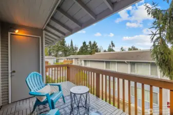 Private covered deck with storage.