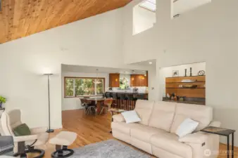 A shot of the living room looking towards the dining room & kitchen.