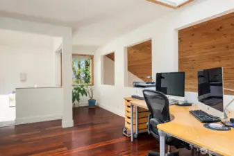The upper loft is versatile and is currently being used as an office.