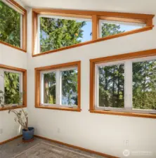 A view of the attached sunroom. Sitting area/reading nook, yoga studio, plant studio?