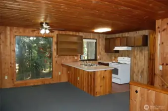 Kitchen eating bar seats 5 and open to dining area.