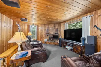 Main level living area with a wood fireplace.