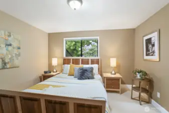 Primary bedroom with private bath and walk-in closet.