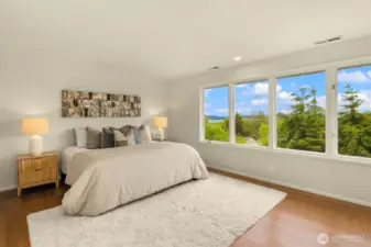 Primary suite with commanding Lake Washington and Cascade Mountain views.
