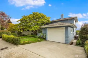 Attached 1-car garage with flat driveway for extra parking.