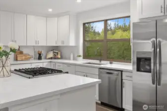 Brand new Kitchen Aide dual fuel range, as well as new fridge/freezer and dishwasher.