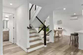Custom railings accentuate the stairwell.