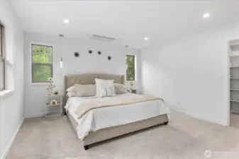 The primary suite is spacious and inviting.