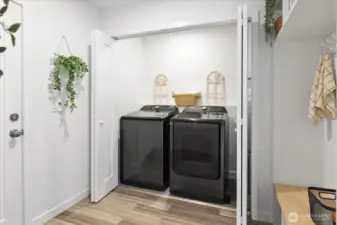 The laundry area with generous storage and folding area.