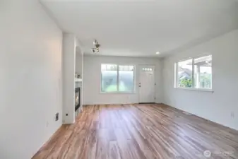 Looking back from the dining area toward the front entry door