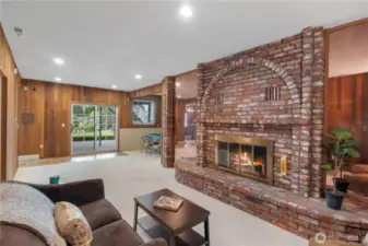 Cozy wood fireplace, slider to patio, room for relaxing and media, as well as game room.