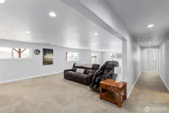 Downstairs living room and wetbar area with 3 extra rooms.