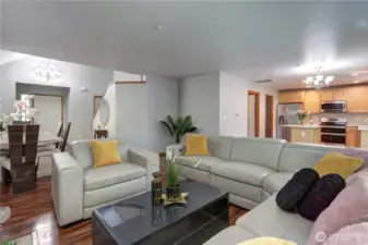 The living room is cozy yet open, ideal for relaxing or entertaining guests.