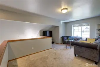 Heading upstairs, you’ll find a well designed second living room/loft - use as a flexible space that could be used for relaxing, working, or even a play area.