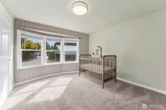 Bedroom with newer carpet.