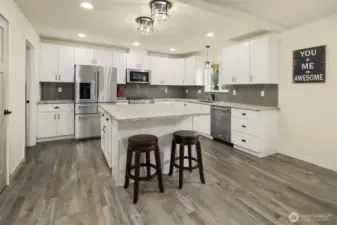 Beautiful open concept kitchen with tons of cabinets and countertop space plus large island