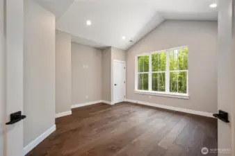 One of 3 upstairs bedrooms, this one has french doors so could also be a TV or rec room.