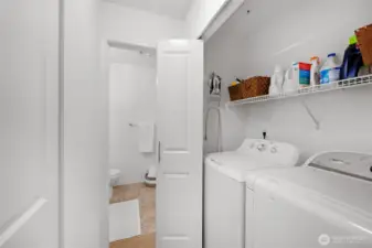 Hallway laundry area, appliance remain with home