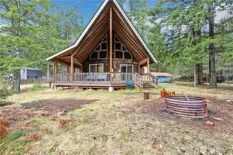 Outdoor fire pit to gather around, roast marshmallows and enjoy the lush forest setting
