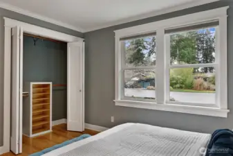 The primary closet has dual hanging rods and custom built-ins, so everything has its place.