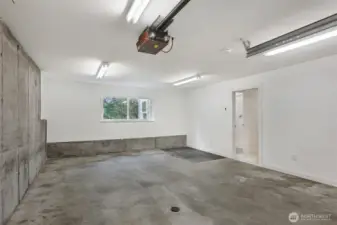 The extra wide 1-car garage is equipped with new or newer insulation (in ceiling and house wall), drywall, garage door, and EV charging!