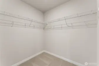 Room for all your wardrobe in primary closet. Photo's are for representational purposes only. Colors and finishes may differ.