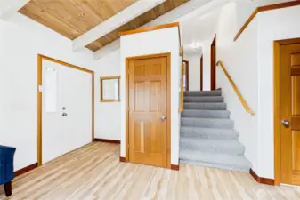 Formal entry on the left and garage entry on the right.