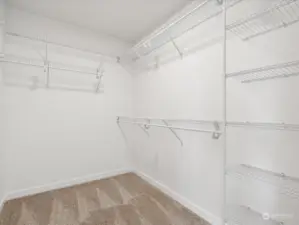 Primary Bedroom walk-in closet.  (Photo is from Lot 2 - a mirror floorplan of this home)