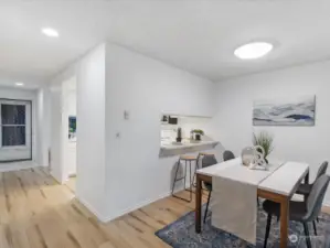 Beautiful vinyl plank flooring throughout the home. The kitchen includes a breakfast bar.