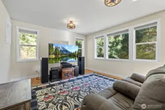 Living room area- or for a bigger table use as a dining room!